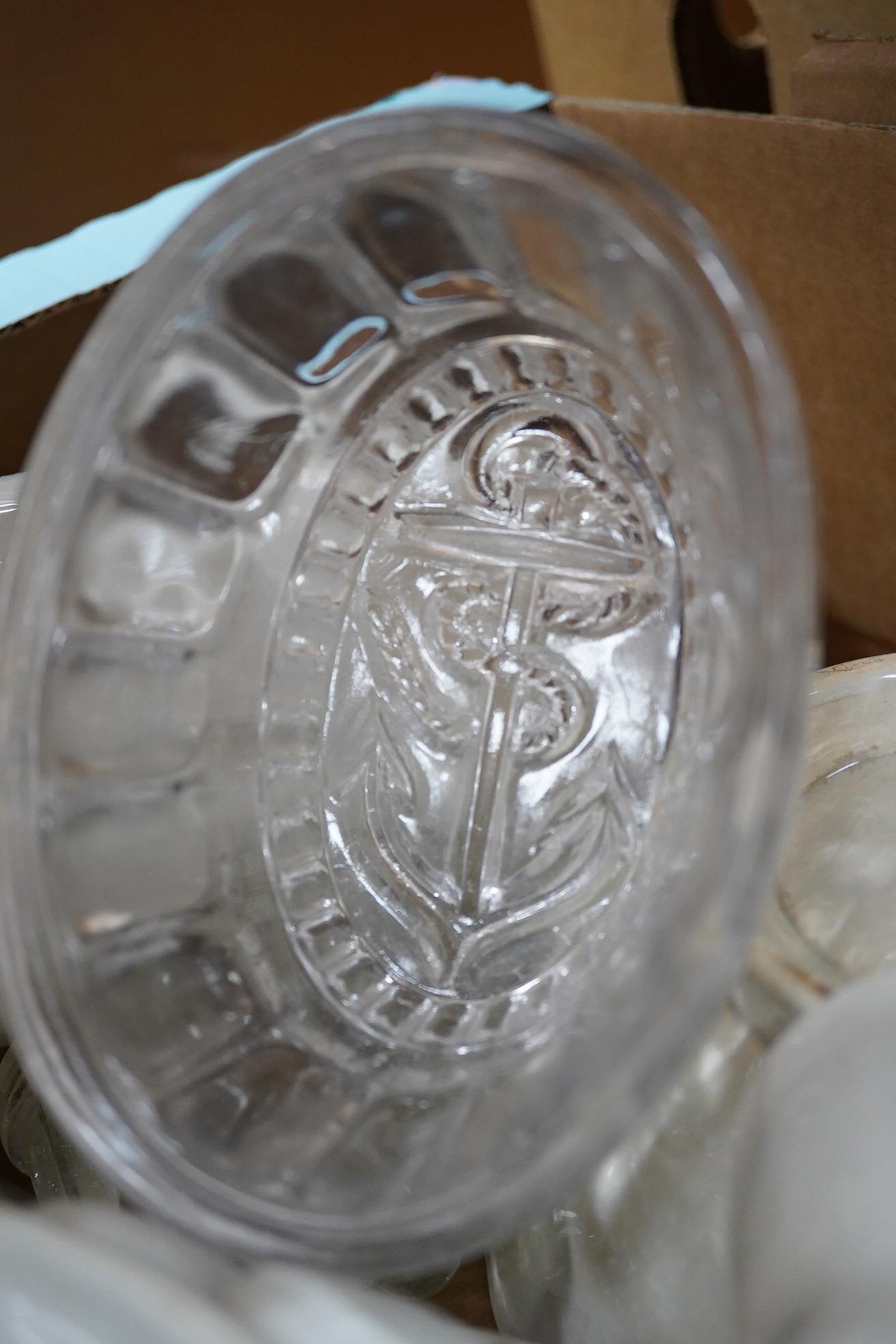 A collection of mostly Victorian ceramic and later glass and metal jelly moulds